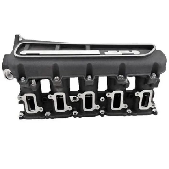 Intake systems – View of a black engine cylinder head with several rectangular openings and screws