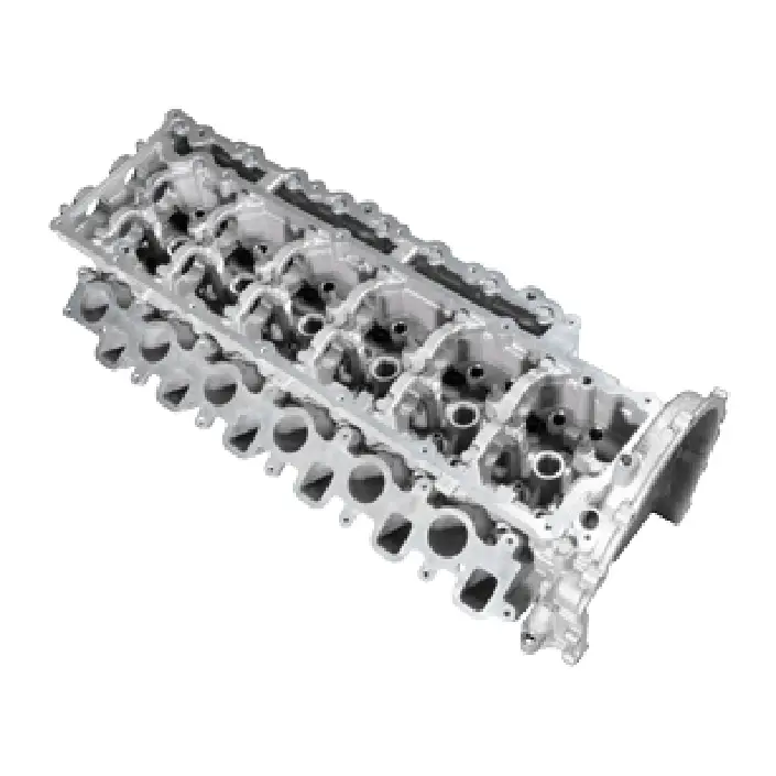 Engine attachments – Close-up of a silver metal cylinder head with visible valve seats and channels